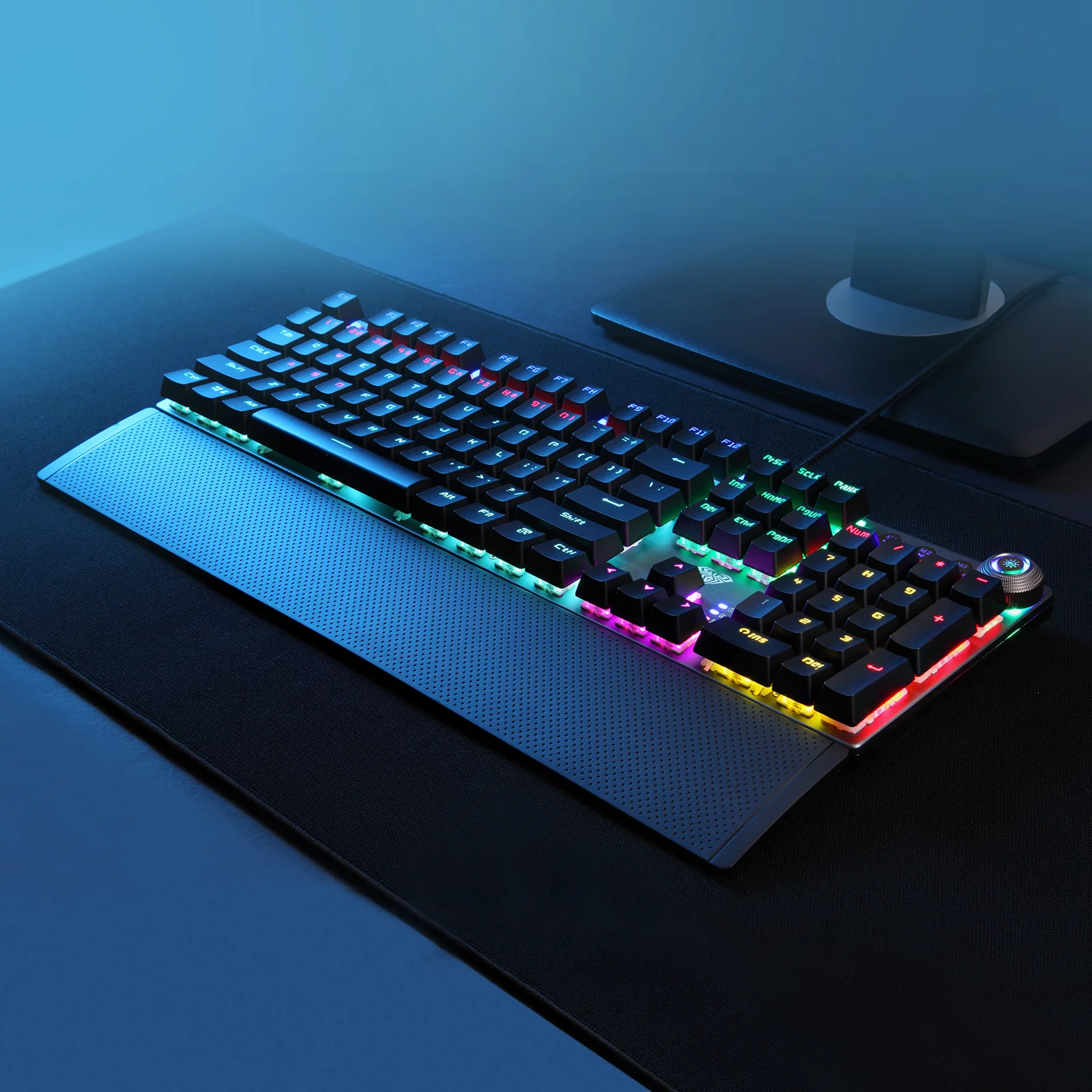 AULA F2058 on a desk in blue light: the lit keys and the glowing ring around the knob