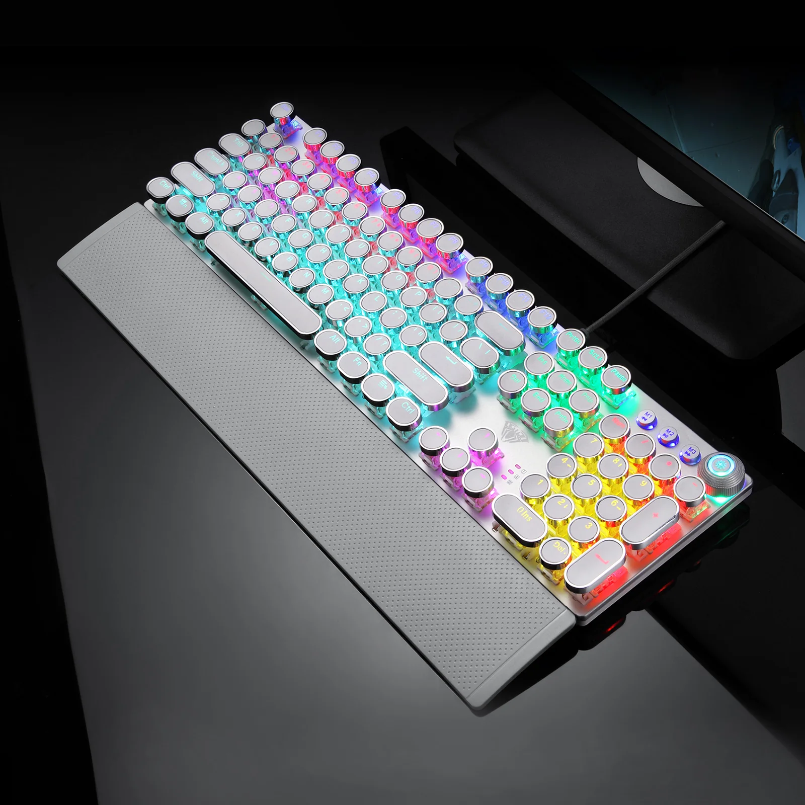 AULA F2088 on a dark desk: the glowing round keycaps and the wrist rest in a gaming setting