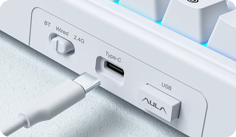 The edge of the AULA F65: the BT — Wired — 2.4G slider, the USB Type-C port and the receiver bay