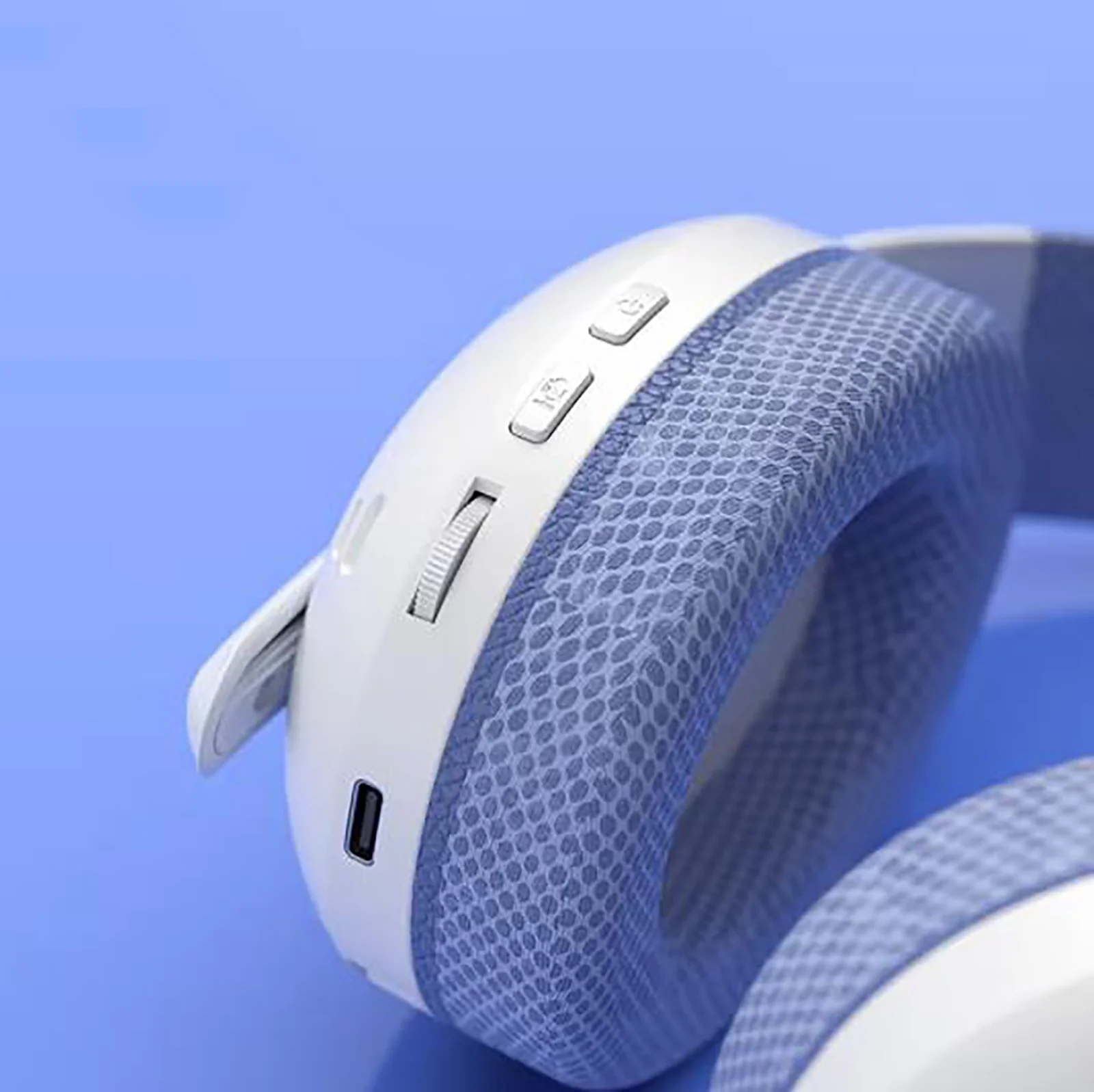 Close-up of the AULA S6 left cup edge: the button, the volume wheel and the USB-C port