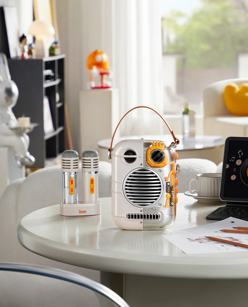 Divoom Spark-Pro with its microphones on a round table in a bright living room
