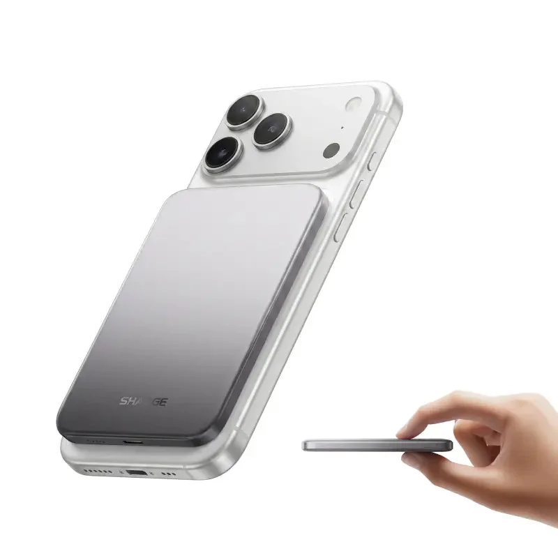 Grey AeroMag Air 5K on an iPhone, with its thin profile held in a hand